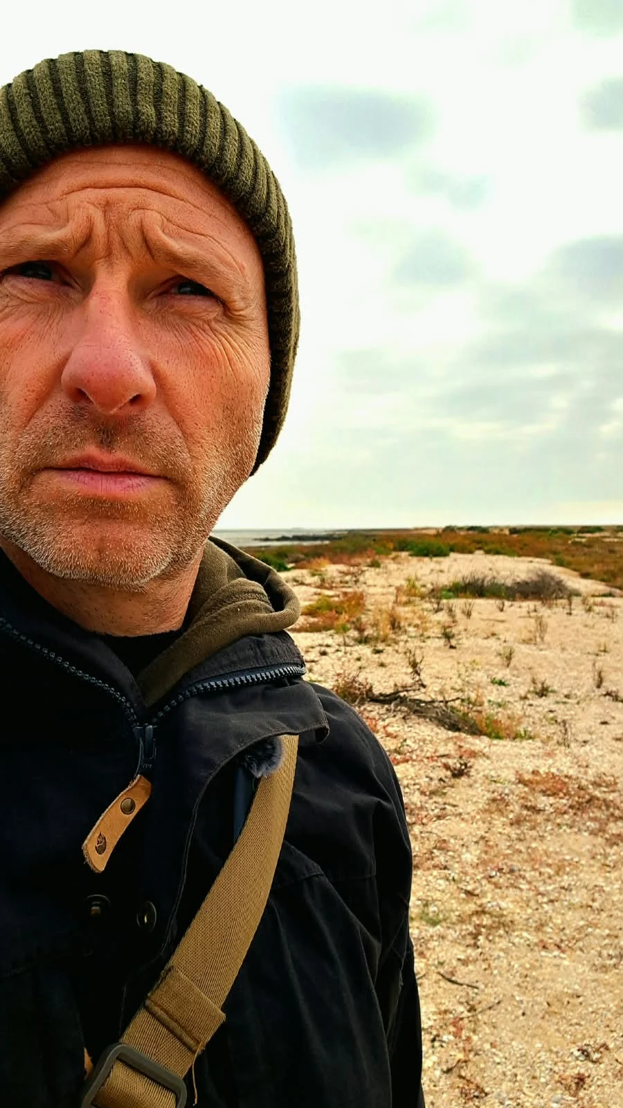 Kes outdoors in a coastal landscape