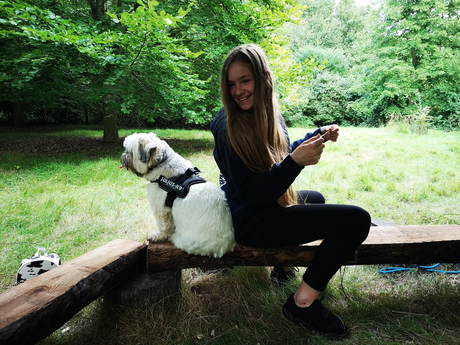 A participant and dog at a woodland session